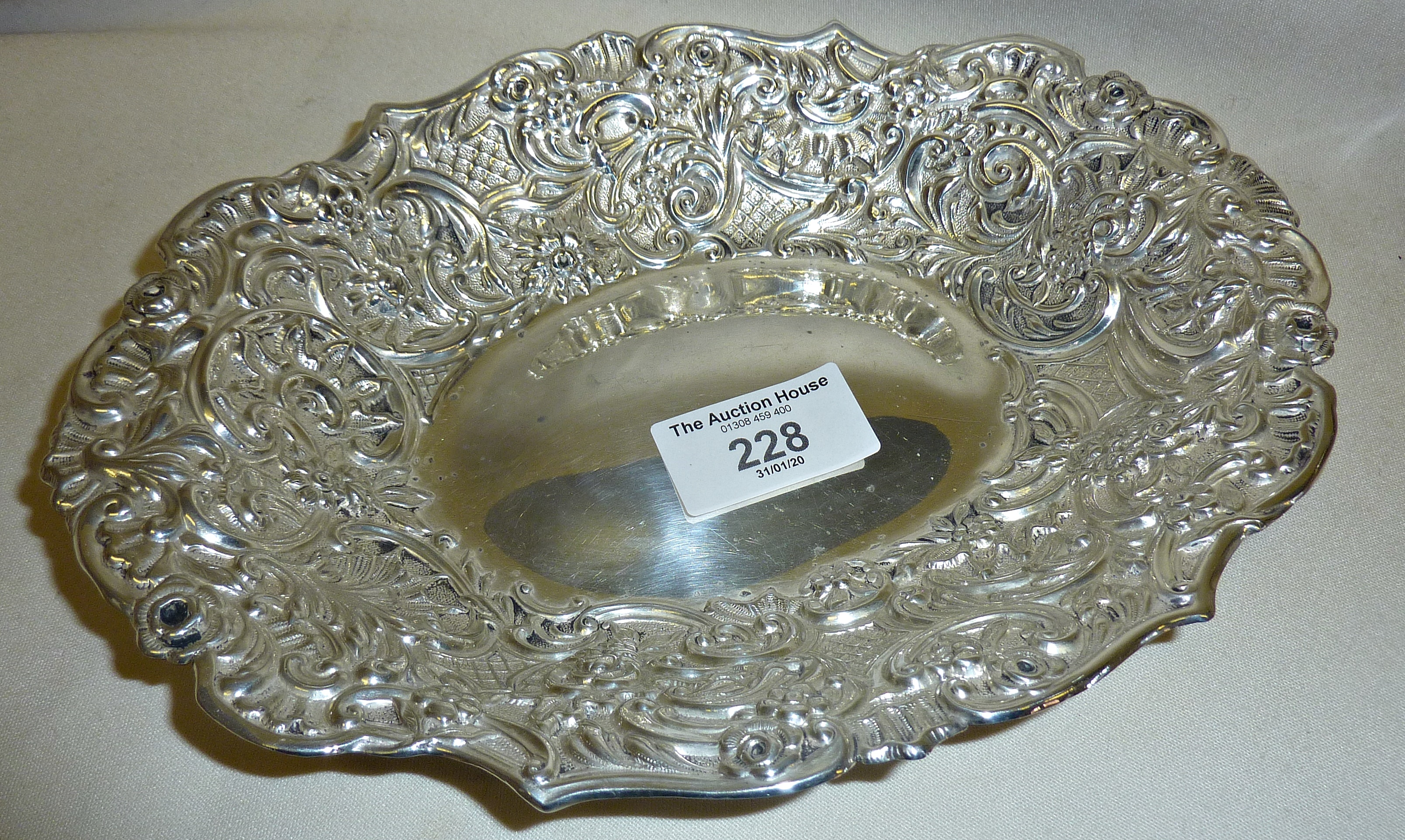 Victorian silver bon bon dish decorated with a foliate repoussé design. Hallmarked for London