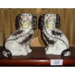 Pair of Staffordshire dogs with baskets