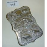 An ornate Anglo-Indian white metal calling card case decorated with raised depictions of animals,