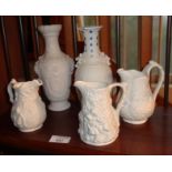 Two Portmeirion relief decoration cream jugs, another similar and two vases (1 A/F)