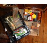 Crate of various fishing lures together with a box of lines and other tackle