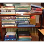 Three shelves of boxed Folio Society Editions of books
