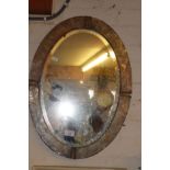 Arts & Crafts silvered beaten copper framed oval mirror, 22" x 16"