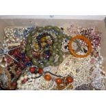 Large collection of beaded necklaces, other jewellery, diamante brooches, etc., inc. faux amber