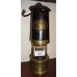 Old brass & iron miner's lamp marked as "Ackroyd & Best Ltd Morley Leeds England"