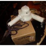 A 1930's Hawkins Supreme cream Bakelite hair dryer in original box and a Mode D Box Brownie camera