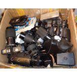 Large box of cameras, lenses, binoculars and accessories. Makers include Nikon and Minolta, etc.