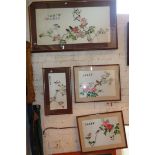 Set of four 20th c. Chinese embroidered pictures of blossoms and birds, signed