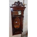 Victorian mahogany narrow wall mirror having carved cornice and shelves with turned supports