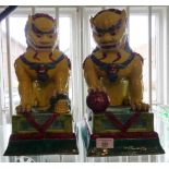 Pair of large Chinese yellow and green glazed Fo dogs, 34cm tall