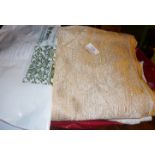 Assorted decorative tablecloths and linen