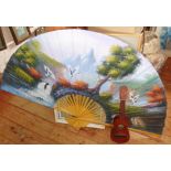 Large decorative Oriental bamboo and painted paper fan and a Manuel Lopez of Madrid ukelele guitar
