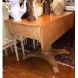 Victorian drop-leaf pine kitchen table on pedestal base with lion paw feet
