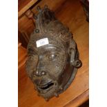 Tribal Art:: Oceanic incised iron wall mask with tattoo-like decoration and feather-pattern