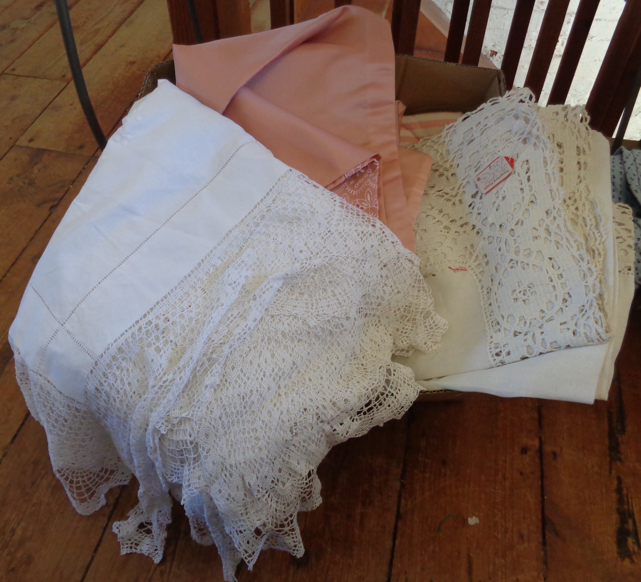 Box of tablecloths and linen