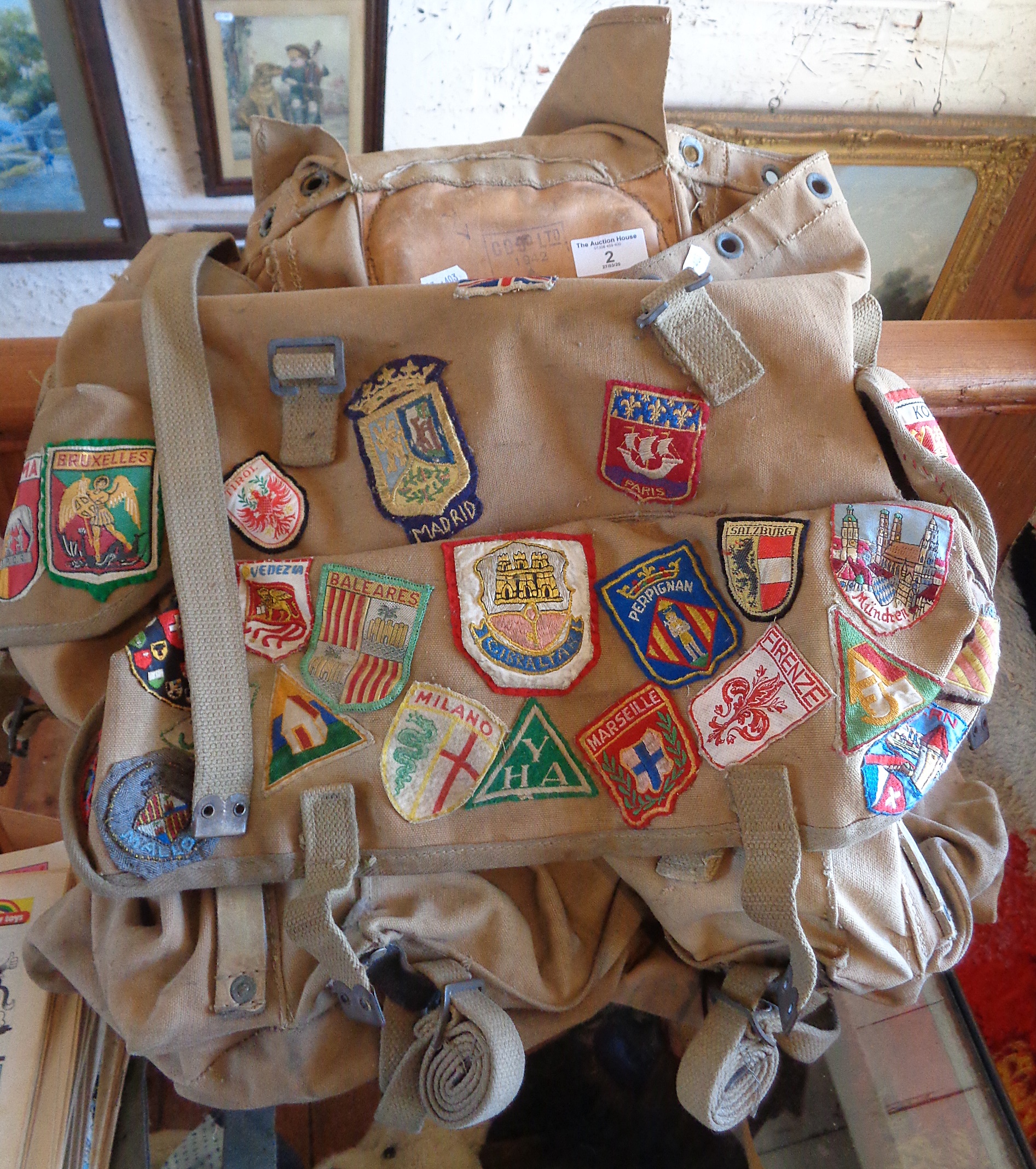 WW2 Army bergen rucksack (1942) covered with many later fabric European town badges