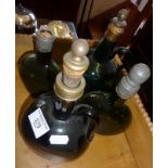 Four 19th c. green glass wine flagons