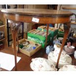 Walnut circular occasional table on slender cabriole legs