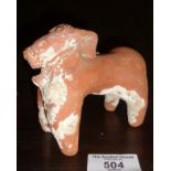 An archaic terracotta study of a domesticated animal with bell around neck (repair to leg)