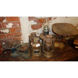Four oil lamps and two sets of scales