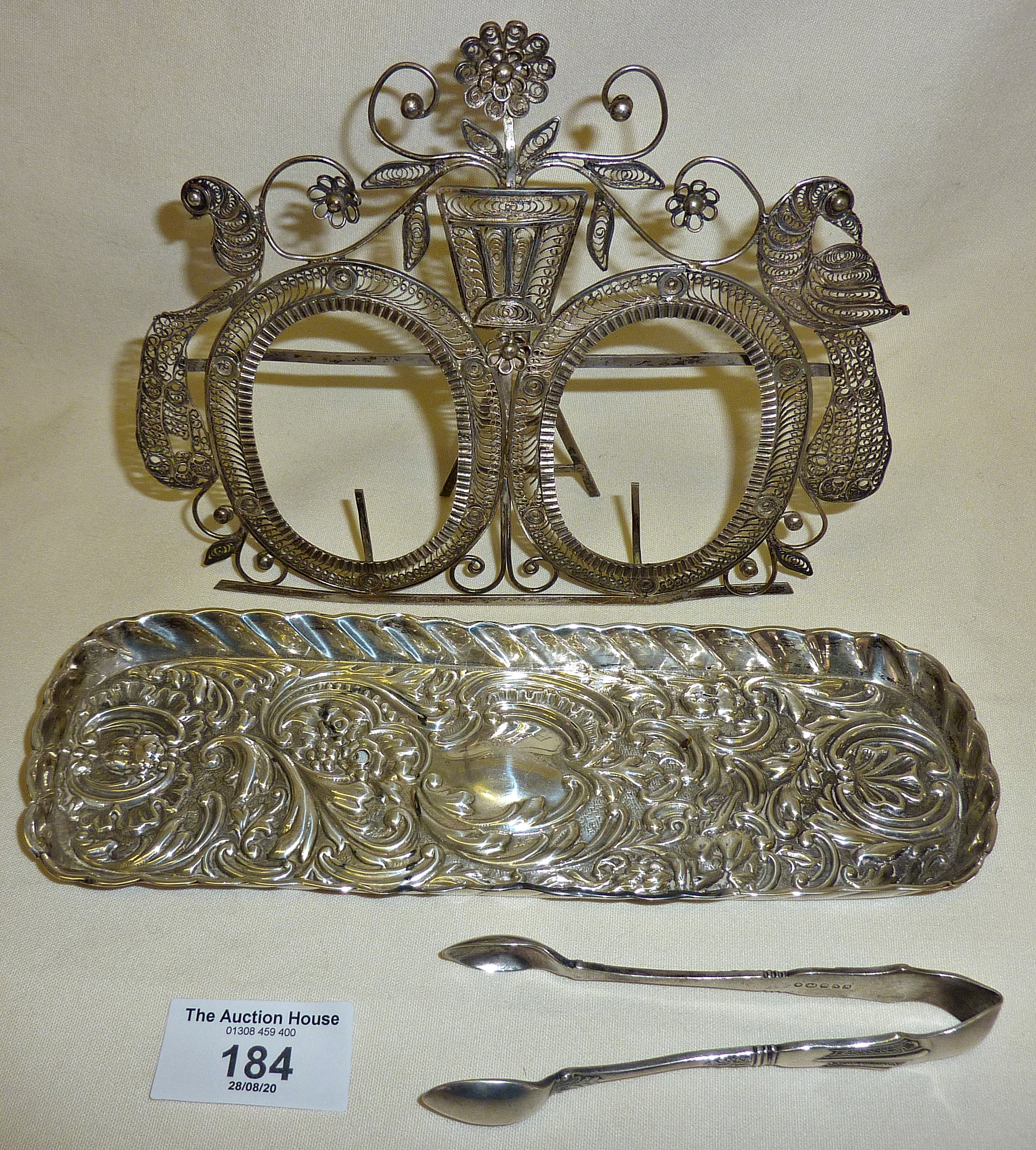 Victorian silver snuffer tray decorated with repoussé cherubs etc. (small hole). Hallmarked for