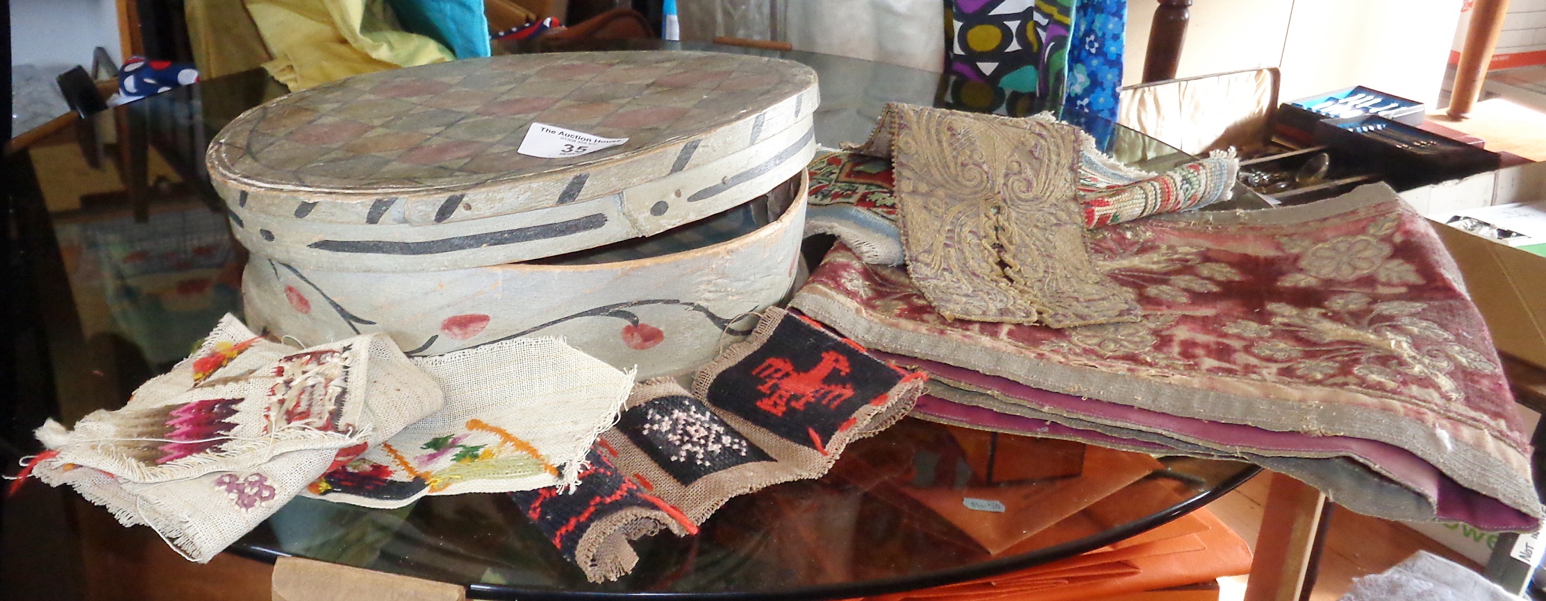 Folk Art American painted circular bentwood box together with fragments of embroidery and woolwork