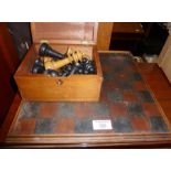 Wooden carved chess set and stained board