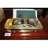 22ct gold plated scale model of a Jaguar XJ220 with associated C.O.A and paperwork