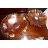 Two orange Carnival glass fluted bowls and another pressed glass dish