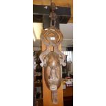 Tribal Art: African carved wood mask with figural headpiece, 38" tall