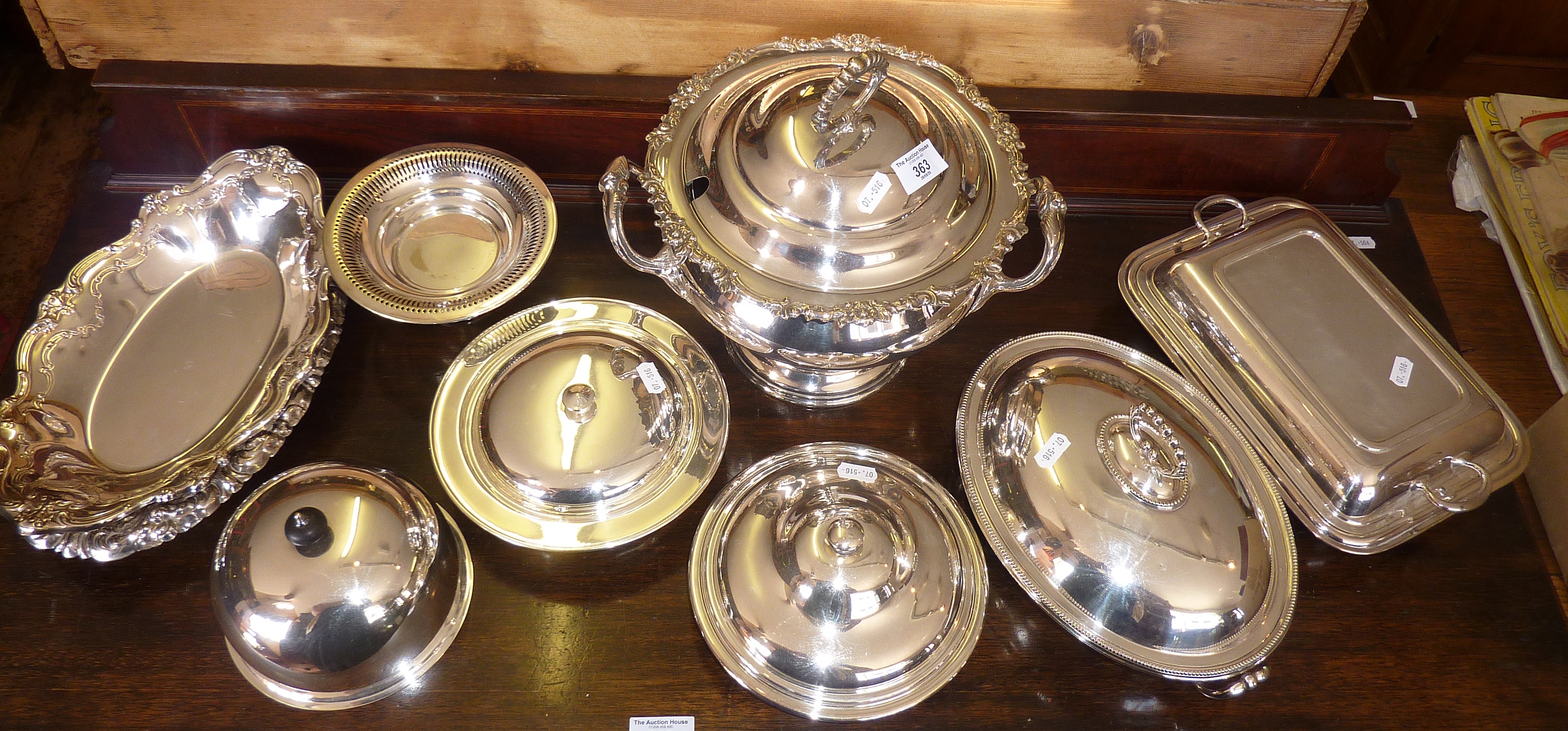 Impressive silver-plated lidded punchbowl, four silver plated entree dishes, and three other dishes