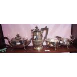 Silver plated teaset of teapot, cream jug and sugar bowl, and a silver plated water pot