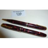 Conway Stewart Dinkie 550 fountain pen and matching propelling pencil No. 25 with red marbled
