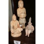 An Asian carved marble figure of a man holding a pot and two similar figures