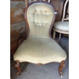 19th c. upholstered balloon-back nursing chair on cabriole legs