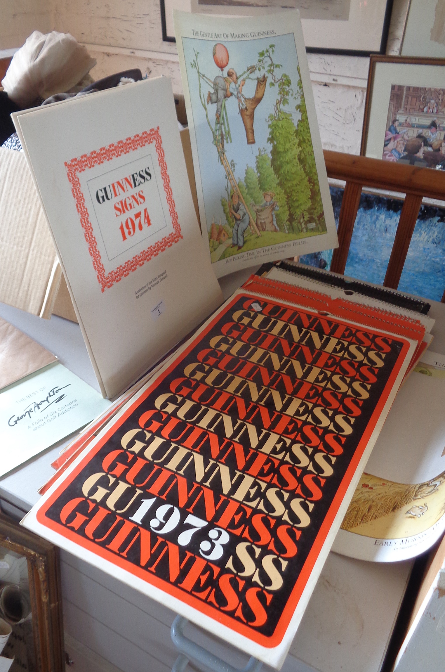 Folios of Guinness posters by Norman Thelwell and John Ireland, 13 Guinness calendars from the