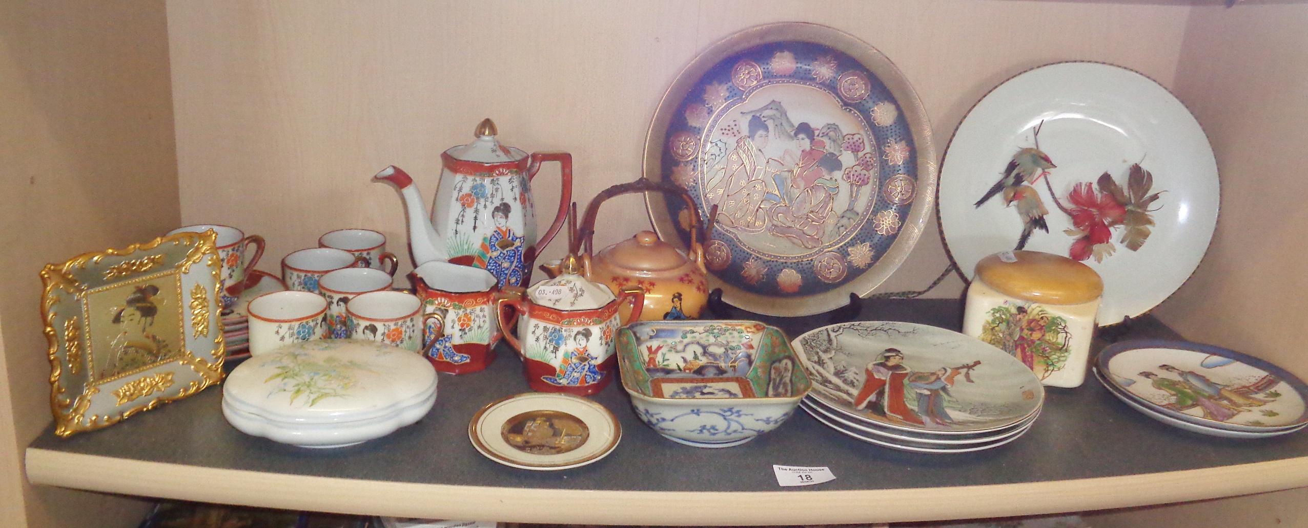 Shelf of Oriental porcelain and china