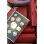 Five Royal Mint UK deluxe sets of Proof coins in red leather cases