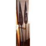 Tribal Art: Two African carved wooden paddles, a South Seas wooden fishing spear and a Borneo wooden