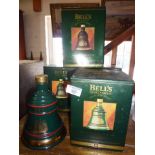 Four Wade china Bell's Whisky Christmas decanters (unopened) with boxes