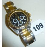 A replica Rolex Daytona Cosmograph wrist watch
