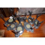 Seven Victorian ebonised wood stands for Chinese tea bowls and saucers