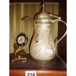 A Persian silver coffee pot and a Kaiser Floral metal bedside clock