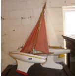 Two vintage painted wooden toy pond yachts, one labelled as Star Yacht