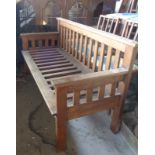 Oak bench with slatted back and seat