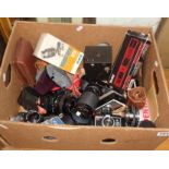 Box of assorted cameras and lenses