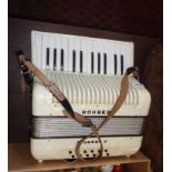 A Hohner Student II accordion in pearl finish