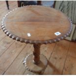 Solid walnut occasional table on carved centre column