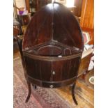 Georgian mahogany bow fronted corner washstand having hinged splash-back above a cupboard and