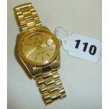 A replica Rolex Oyster Perpetual Day-Date wrist watch with gold dial